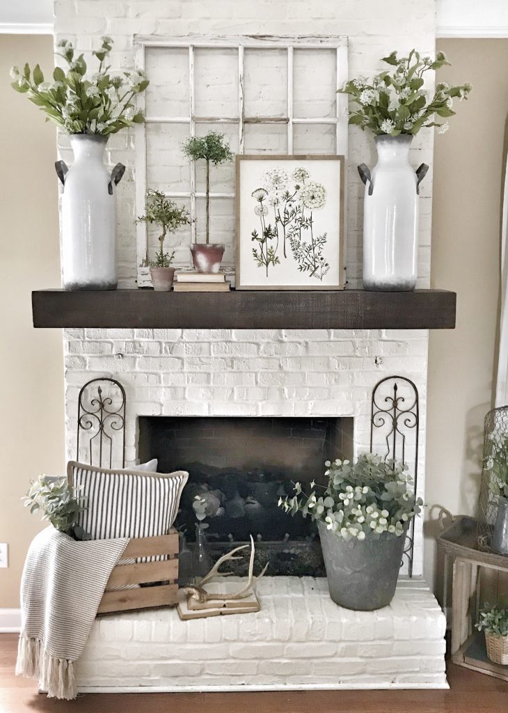 Does that pique your interest? Check out how to work unique pottery art into a chic farmhouse fireplace mantel design!