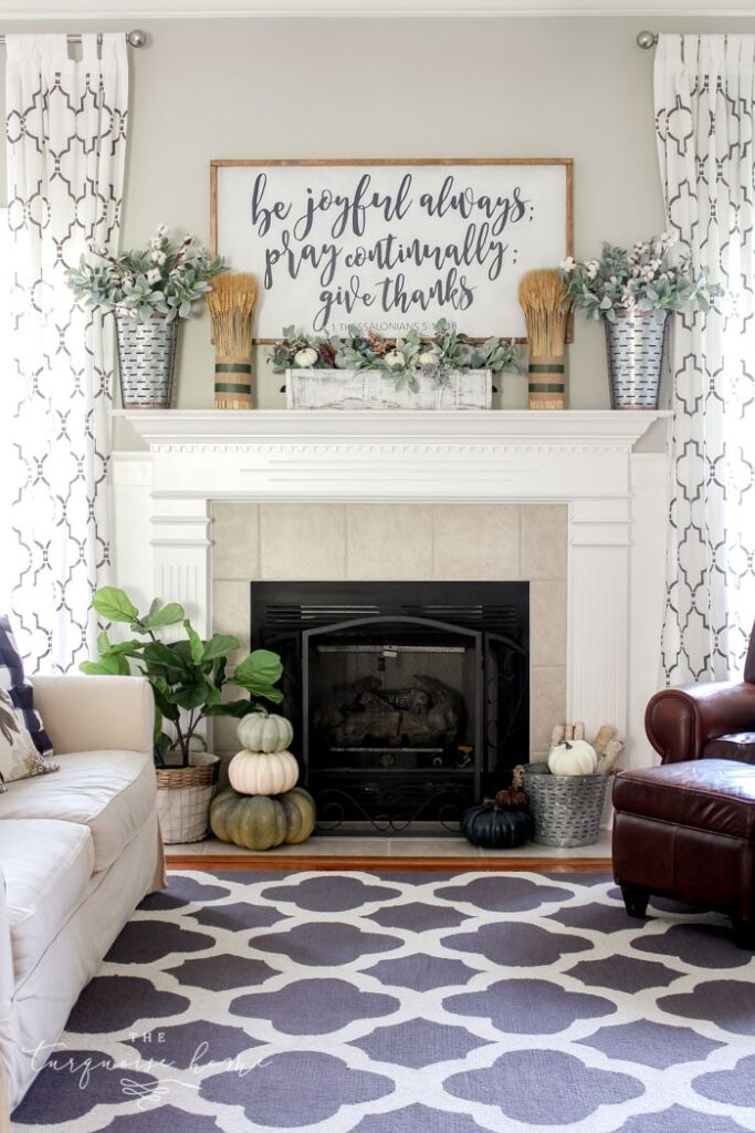 If you’re on the hunt for an easy-to-achieve look, check out this simple farmhouse mantel that uses wheat as a subtle but perfect accent to a big center statement piece.