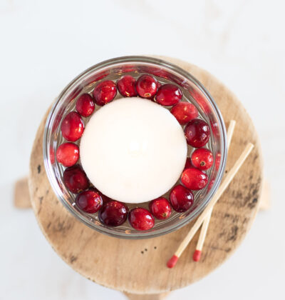 This cranberry floating candle centerpiece is a simple, inexpensive to light up a special winter night. It’s my go-to winter candle centerpiece in your farmhouse.