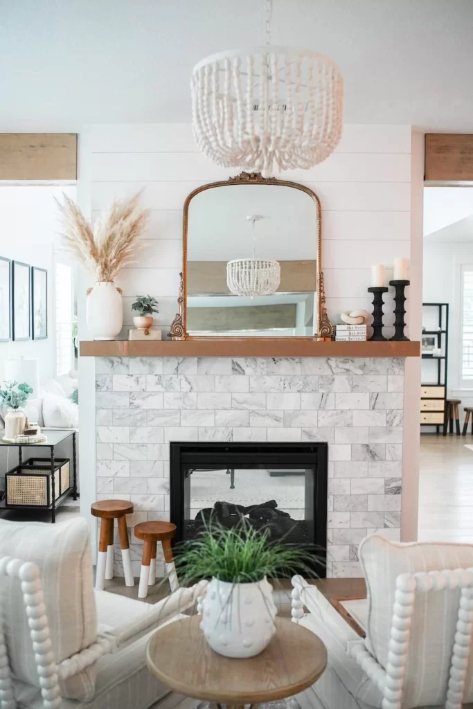 This simple and chic fireplace idea can be achieved with layers of varying heights.